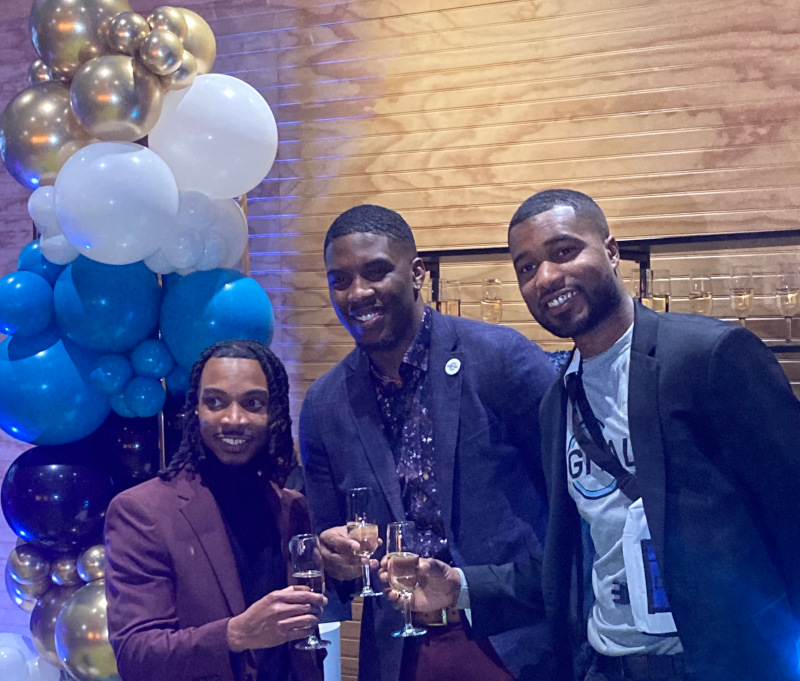 January 26, 2024 - Jonathan Stone, Joshua Edmonds, and Chad Porter celebrating with a champagne toast at DigitalC Citywide Network Launch Party!