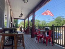 June 6, 2021 -  The front porch of Cornwall Country Market in Cornwall Bridge, Connecticut, is a great place to enjoy a meal