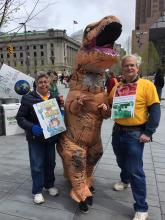 Julie and Stuart with friendly dinosaur at March for Science Cleveland 
