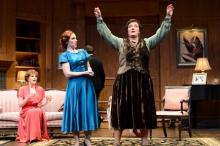 Actor Laurie Birmingham (right, as the madcap medium Madame Arcati) takes center as Maggie Kettering (left, as Ruth) and Molly McGinnis (far left, as Mrs. Bradman)