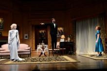 Actor Eric Damon Smith (as Charles) attempts in vain to introduce his current wife, Maggie Kettering (right, as Ruth), to the ghost of his deceased first wife, Shanara Gabrielle (left, as Elvira)