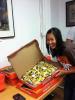 Newschannel 5's Janet Nguyen Lueken offering pizza to TweetUp attendees
